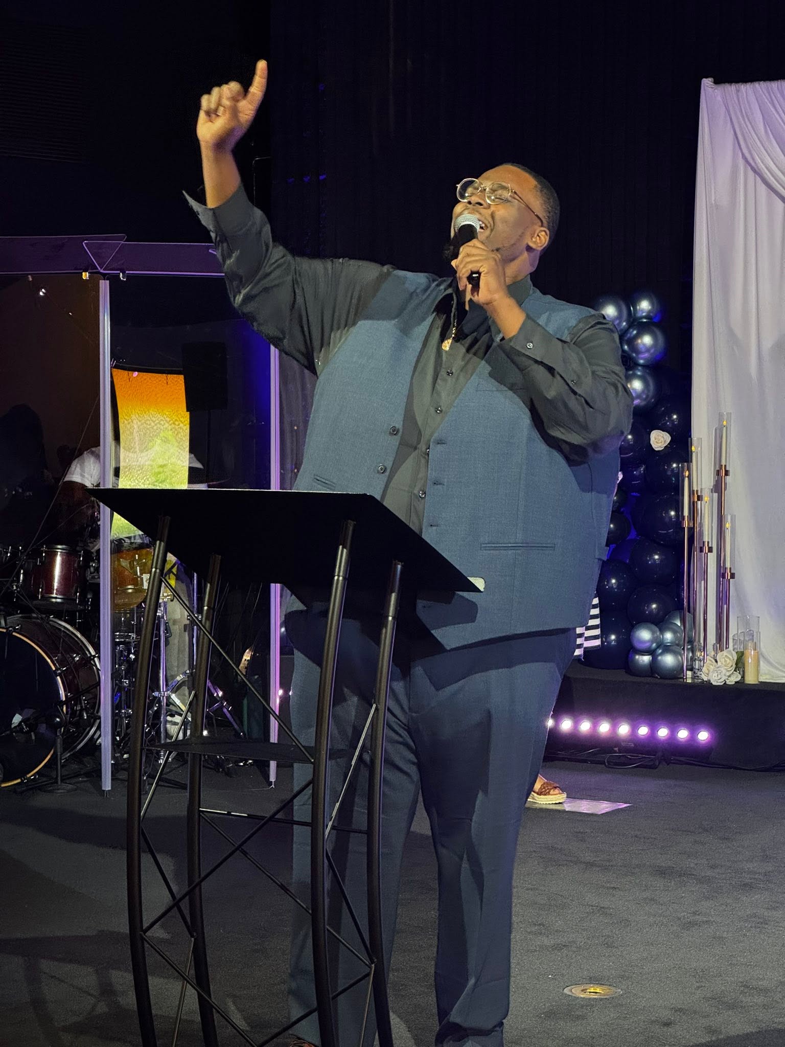 Pastor Ray Watson preaching during a Faith Family Life Church service